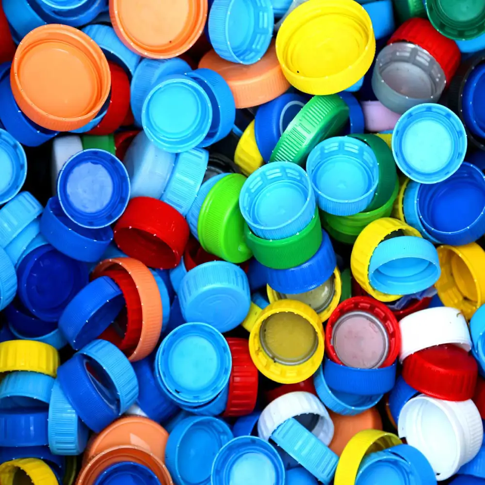 Sticking wads in plastic bottle caps